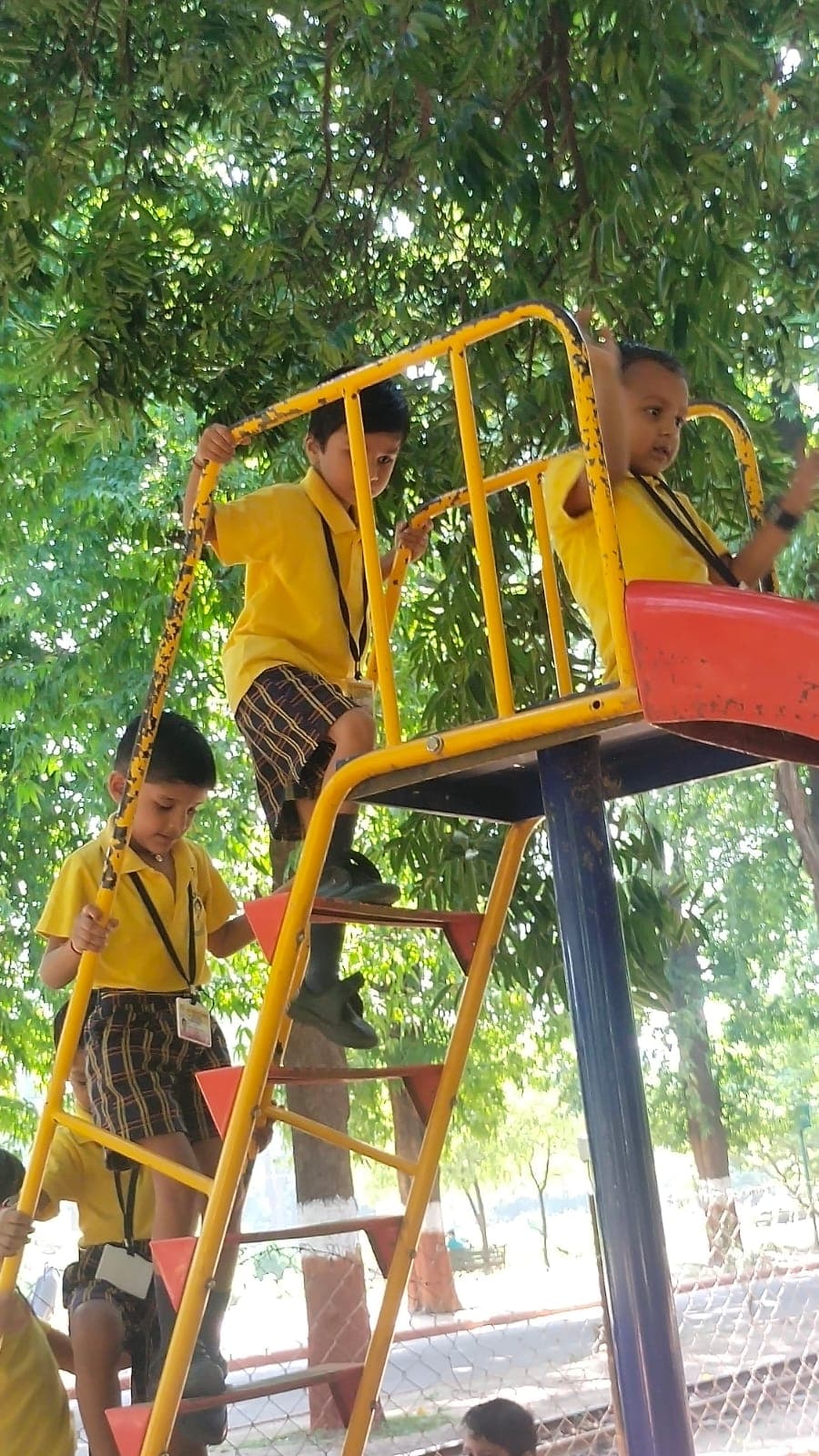Children playing on the school slide