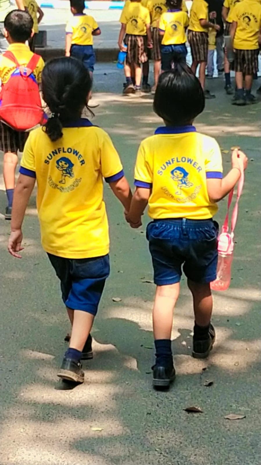 Children walking together at Sunflower Preschool